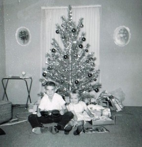 Well, aren't those a couple of cute kids circa the early 1960s. Yep, it's me and my sister Jody. Lots of folks had silver Christmas trees back then.