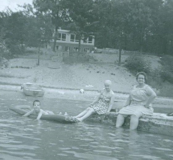 My cousin John Snyder floats on an inner tube while under the watchful eye of his mother Juanita and grandmother Ethel. The time period is circa late 1950s.